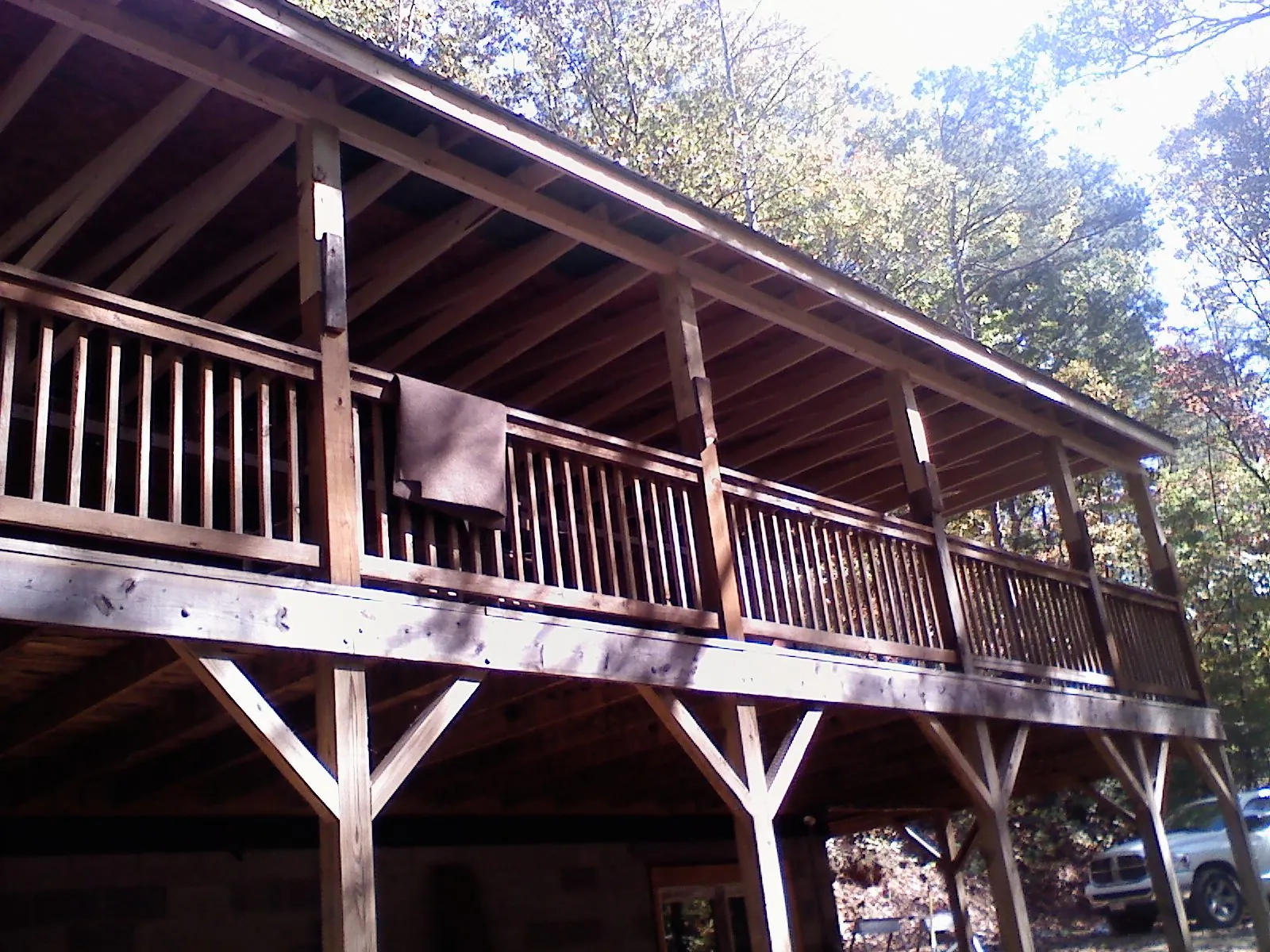 Timber framing under a new elevated porch and deck — Roof Leak Repair in West Camp by Roofing Brothers
